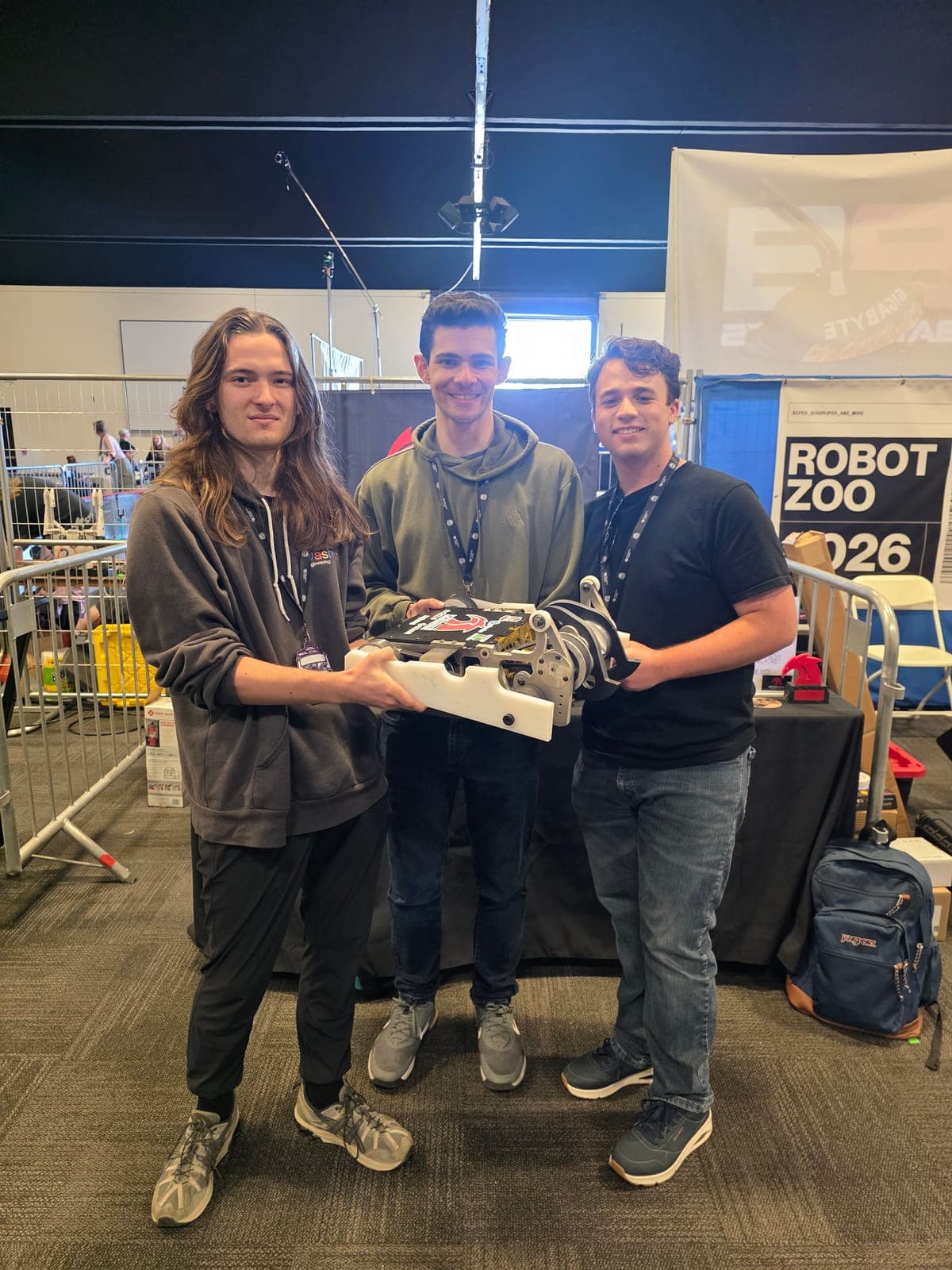 The three-person Shear Force team with the robot at Open Sauce 2026